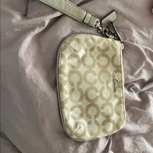 Women’s gold coach wristlet